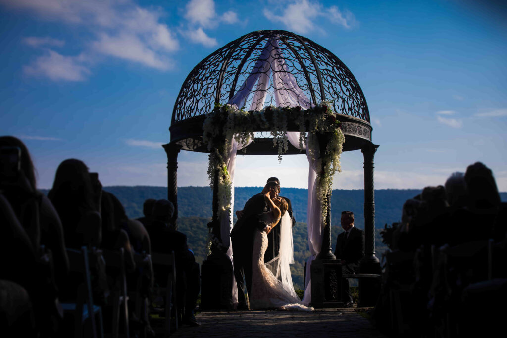 Couple kisses beneath Ridgecrest's iron gazebo