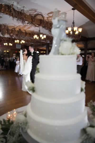 Stroudsmoor Country Inn - Stroudsburg - Poconos - Real Weddings - Wedding Cake With Bride And Groom Dancing In Background