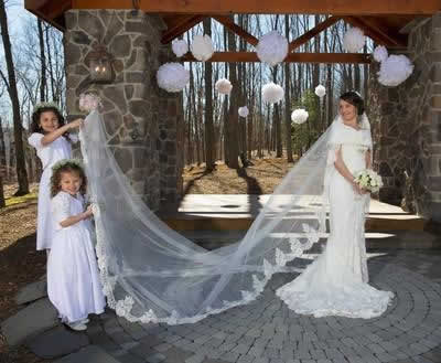 Stroudsmoor Country Inn - Stroudsburg - Poconos - Real Weddings - Bride Having Train Of Dress Held Up