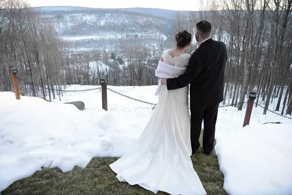 Stroudsmoor Country Inn - Stroudsburg - Poconos - Real Weddings - Bride And Groom Surrounded By Snow Covered Mountains