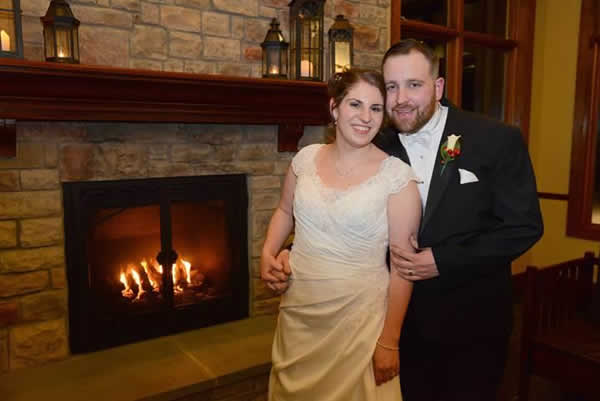 Stroudsmoor Country Inn - Stroudsburg - Poconos - Real Weddings - Bride And Groom Near The Warmth Of The Fireplace