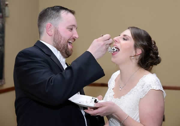 Stroudsmoor Country Inn - Stroudsburg - Poconos - Real Weddings - Groom Feeding Bride Cake