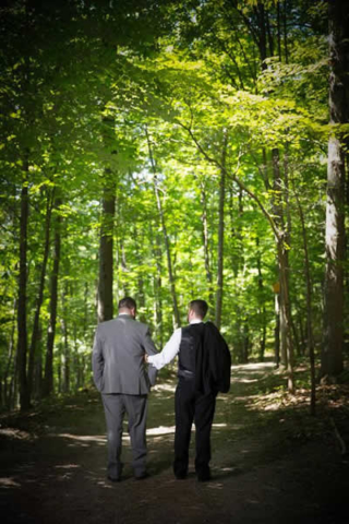 Stroudsmoor Country Inn - Stroudsburg - Poconos - Real Weddings - Happy Couple Stroll Outside