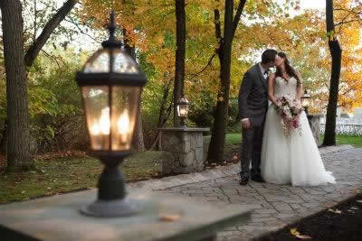 Stroudsmoor Country Inn - Stroudsburg - Poconos - Real Weddings - Romantic Kiss For The Newlyweds Outside