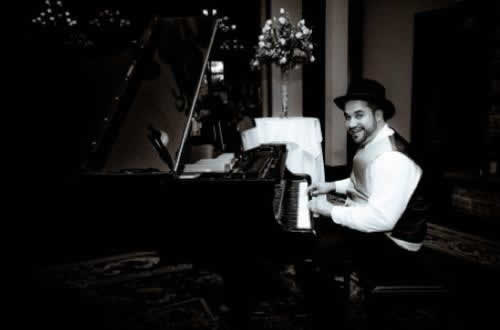 Stroudsmoor Country Inn - Stroudsburg - Poconos - Real Weddings - Groom Playing Piano