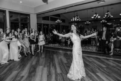 Stroudsmoor Country Inn - Stroudsburg - Poconos - Real Weddings - Bride Looking On After Throwing Bouquet