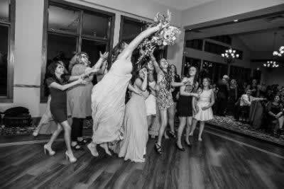 Stroudsmoor Country Inn - Stroudsburg - Poconos - Real Weddings - Guests Trying To Catch Wedding Bouquet