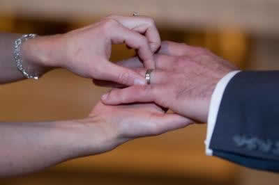 Stroudsmoor Country Inn - Stroudsburg - Poconos - Real Weddings - Bride Putting Ring On Grooms Finger