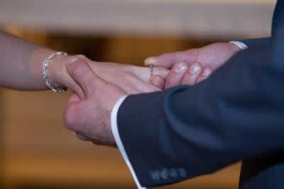 Stroudsmoor Country Inn - Stroudsburg - Poconos - Real Weddings - Groom Putting Ring On Brides Finger