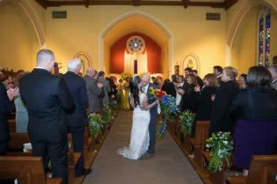 Stroudsmoor Country Inn - Stroudsburg - Poconos - Real Weddings - Newlywed Kissing In Chapel