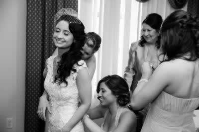 Stroudsmoor Country Inn - Stroudsburg - Poconos - Real Weddings - Bridesmaids Helping Bride With Dress