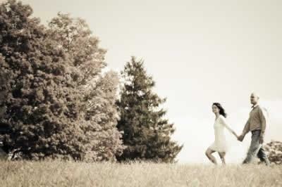Stroudsmoor Country Inn - Stroudsburg - Poconos - Real Weddings - Newlyweds Walking Out Near Evergreens