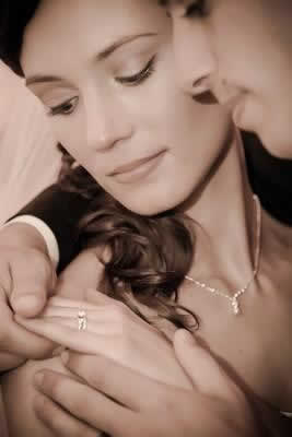 Stroudsmoor Country Inn - Stroudsburg - Poconos - Real Weddings - Bride And Groom Gazing At Brides Wedding Ring