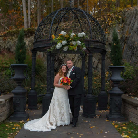 Stroudsmoor Country Inn - Stroudsburg - Poconos - Real Weddings - Bride And Groom Posing Near Outdoor Gazebo