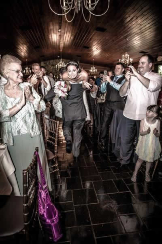 Stroudsmoor Country Inn - Stroudsburg - Poconos - Real Weddings - Groom Carrying Bride Over His Shoulders