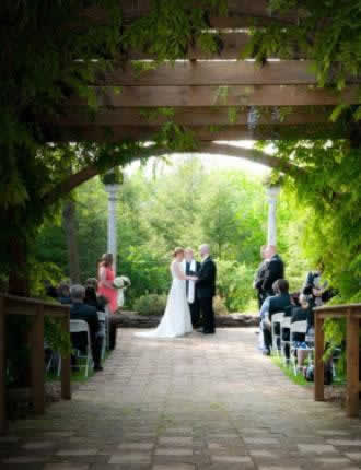 Stroudsmoor Country Inn - Stroudsburg - Poconos - Intimate Wedding - Bride And Groom In Auradell Grotto Joined By Wedding Party