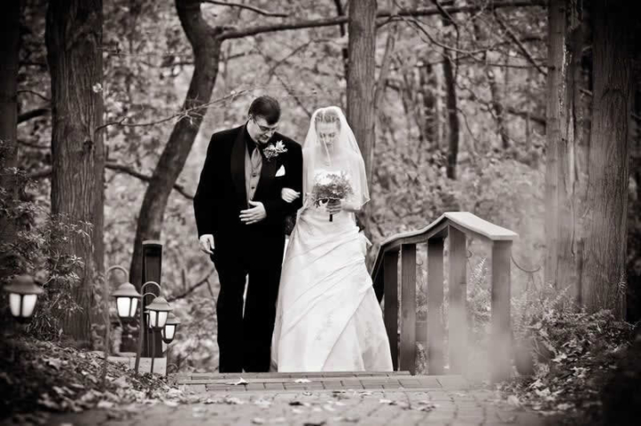 Stroudsmoor Country Inn - Stroudsburg - Poconos - Woodlands Outdoor Wedding - Bride And Groom Exiting On Staircase