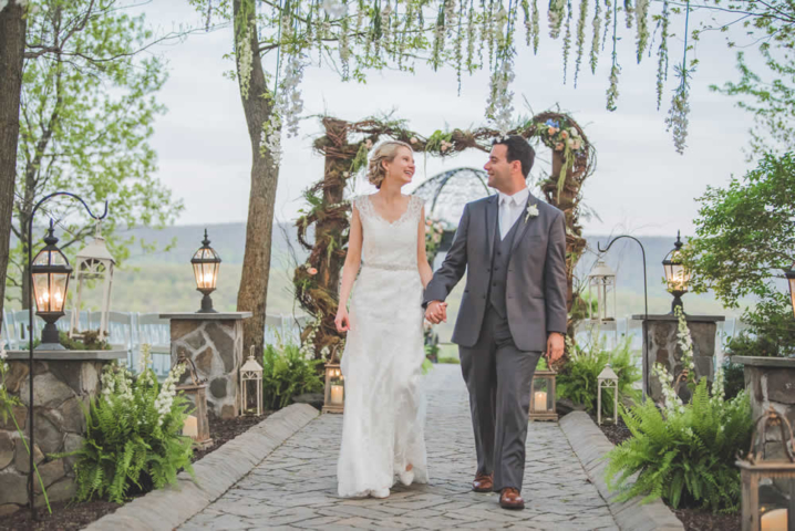 Wedding couple posing, holding hands