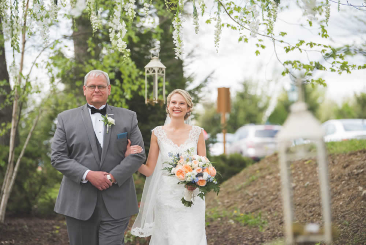Father walking bride down the aisle
