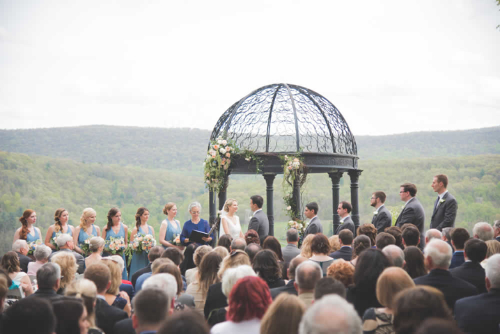 Wedding ceremony - guests sitting, wedding couple, bride's maids and groomsmen