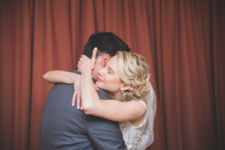 Bride and groom hugging