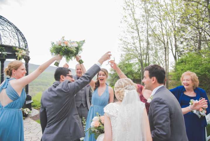 Wedding party toasting couple