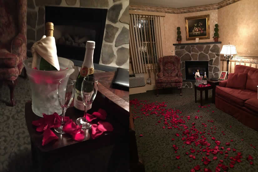 Champagne and rose petals in room