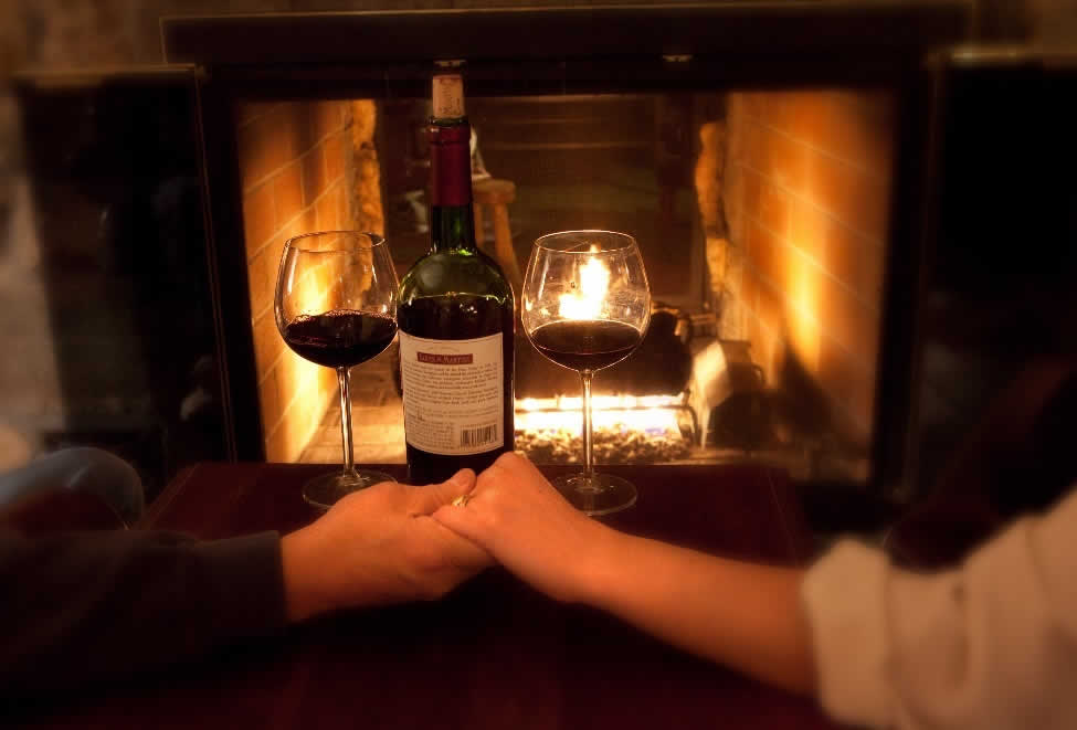 Couple holding hands fireplace