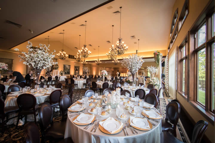 Large reception ballroom with beautiful table settings