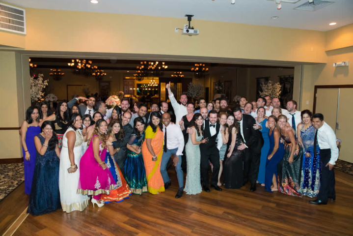 Happy group shot with wedding couple