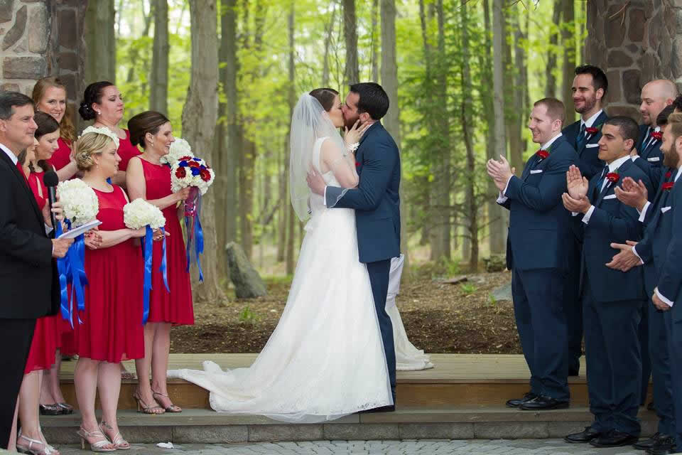 Red, White and Blue Themed Wedding - Couple Kissing