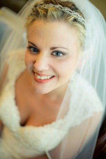 Bride posing in her veil