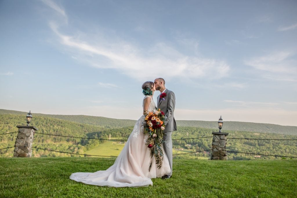 wedding couple kiss mountain view