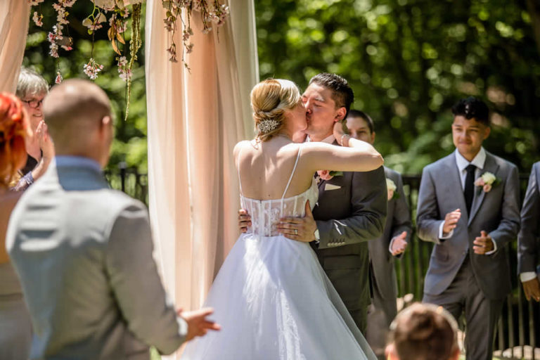 Wedding ceremony - kiss - outdoor wedding - Pocono wedding