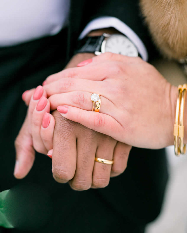 Wedding couple's hands with wedding bands