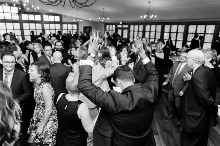 Family and friends dancing wedding reception
