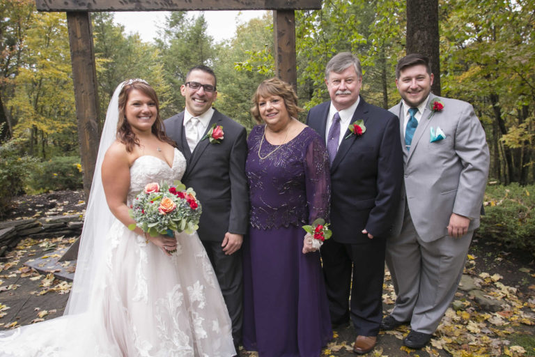 Bride and groom outside with brides family floral and decor lawnhaven