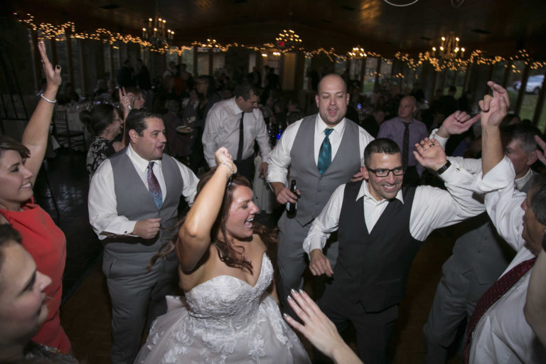 Wedding party dancing with bride and groom lawnhaven