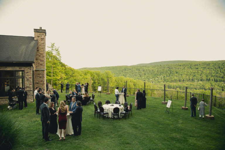 Family and friends gather outside overlooking beautiful view terraview