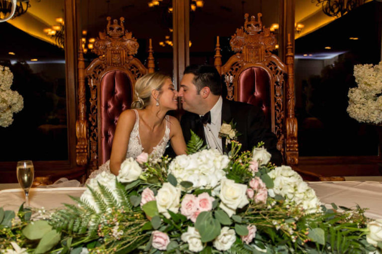 Bride and groom at head table floral and decor terraview