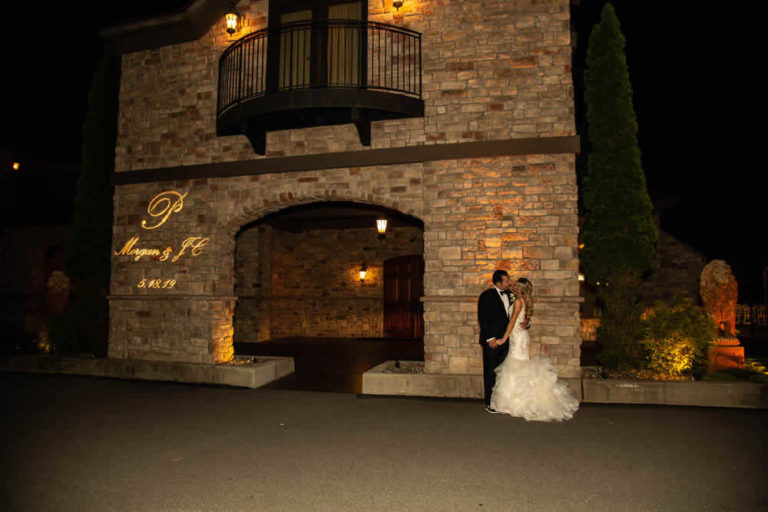 Wedding couple in front of venue terraview