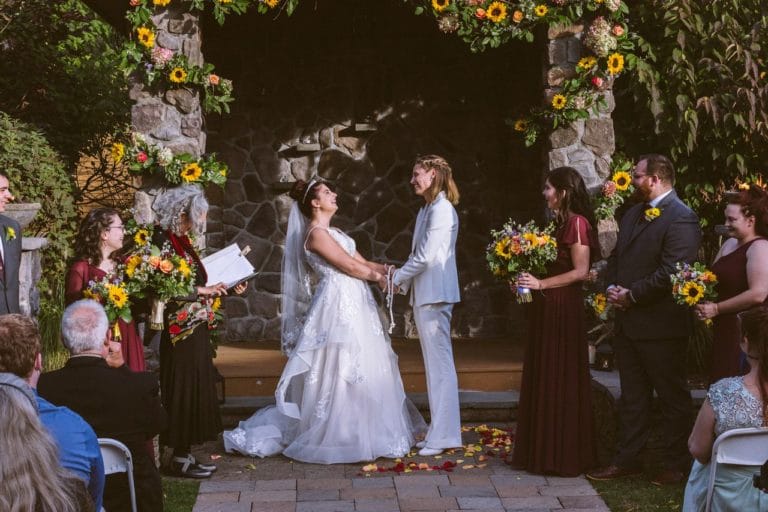 Wedding ceremony - bride and bride - happy wedding couple holding hands