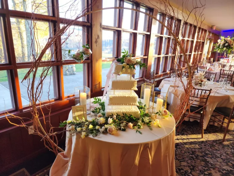 Cake in gold hoop with curly willow. Attend a Wedding Expo.