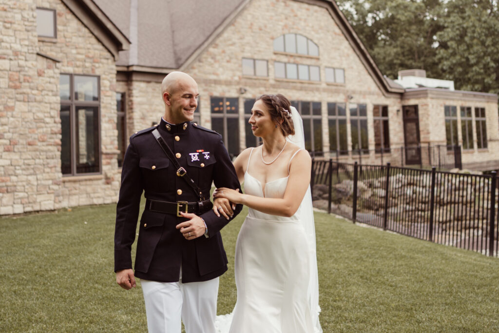 Couple smiles at one another in front of Stroudsmoor's Terraview