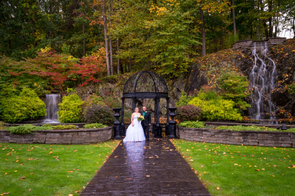 Bride and groom in front of Terraview waterfalls