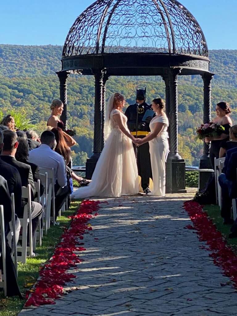 Wedding Resort in the Poconos 15 Two brides are married by an officiant dressed as Batman