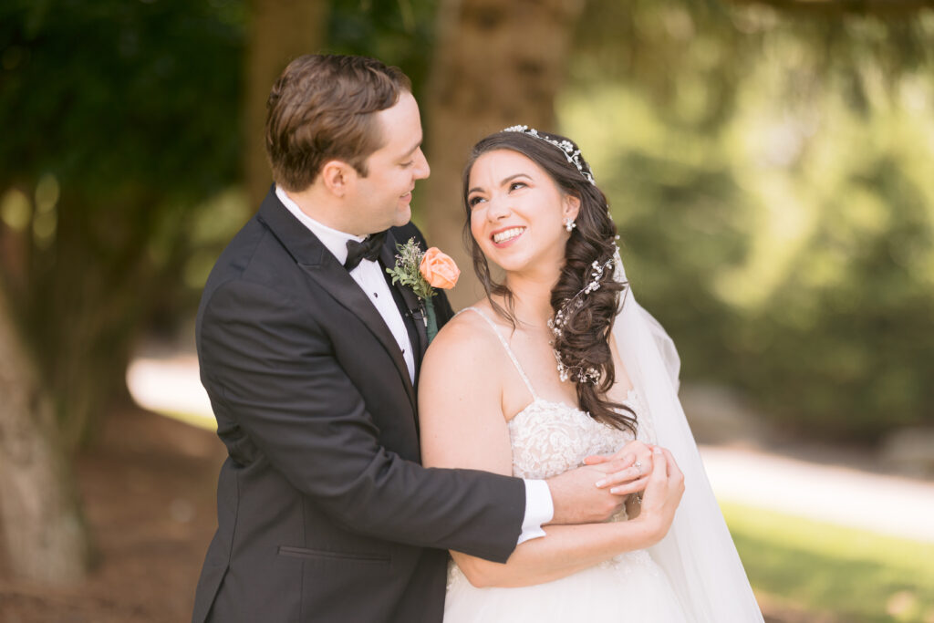 Bride and groom embrace at Ridgecrest ceremony site