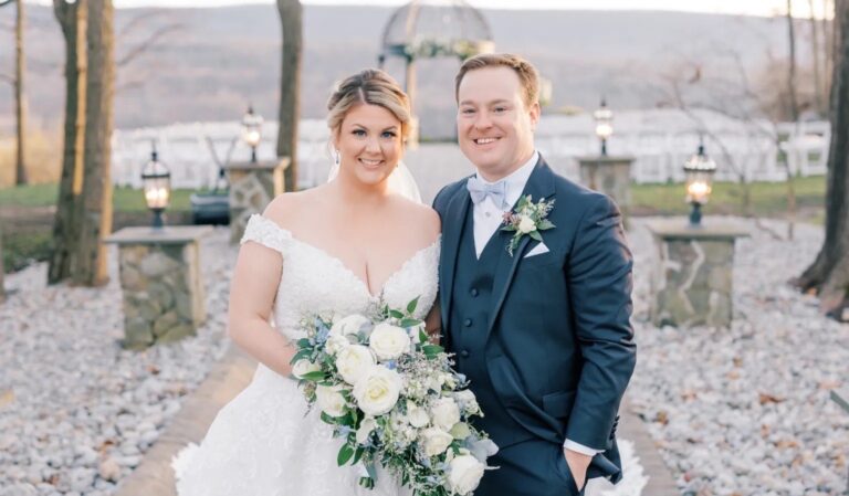 Bride and groom standing in aisle