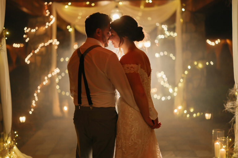 Bride and groom beneath Lawnhaven breezeway