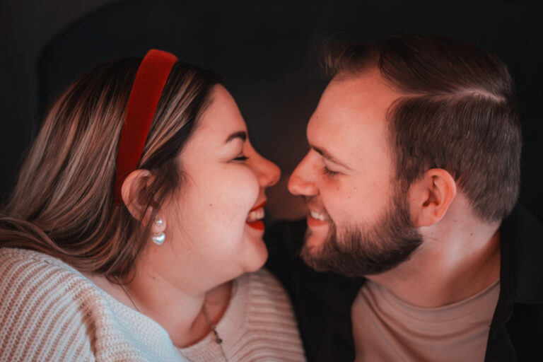 Couple leans in for a kiss